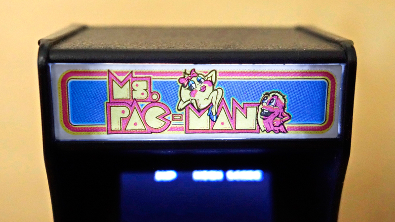 The half-tone printing effect on this light-up marquee adds to the authentic feel of these tiny arcades.
